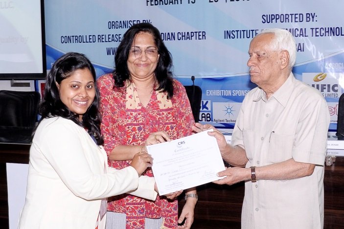 Ms. Preshita Desai receiving Best Poster award from Prof. H. L. Bhalla
